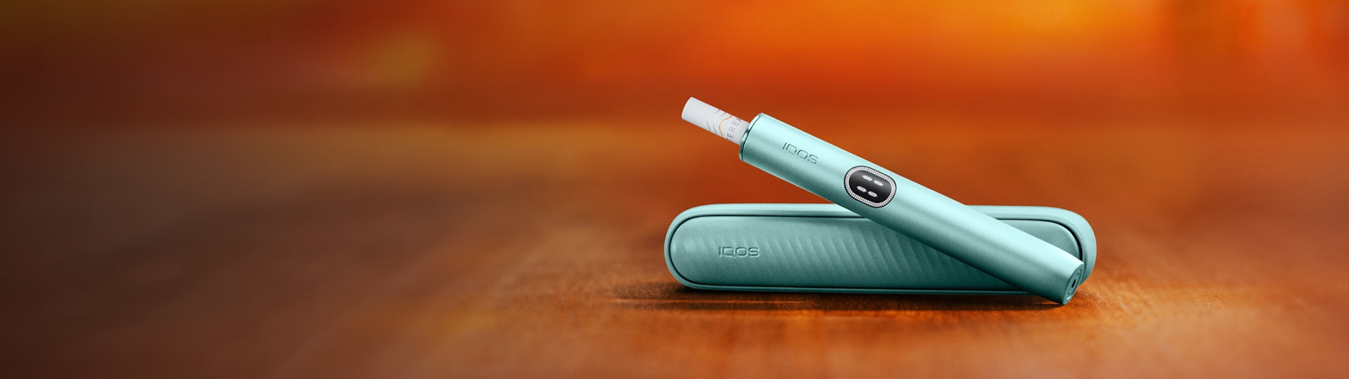 A jade green IQOS ILUMA PRIME Holder and Pocket Charger.